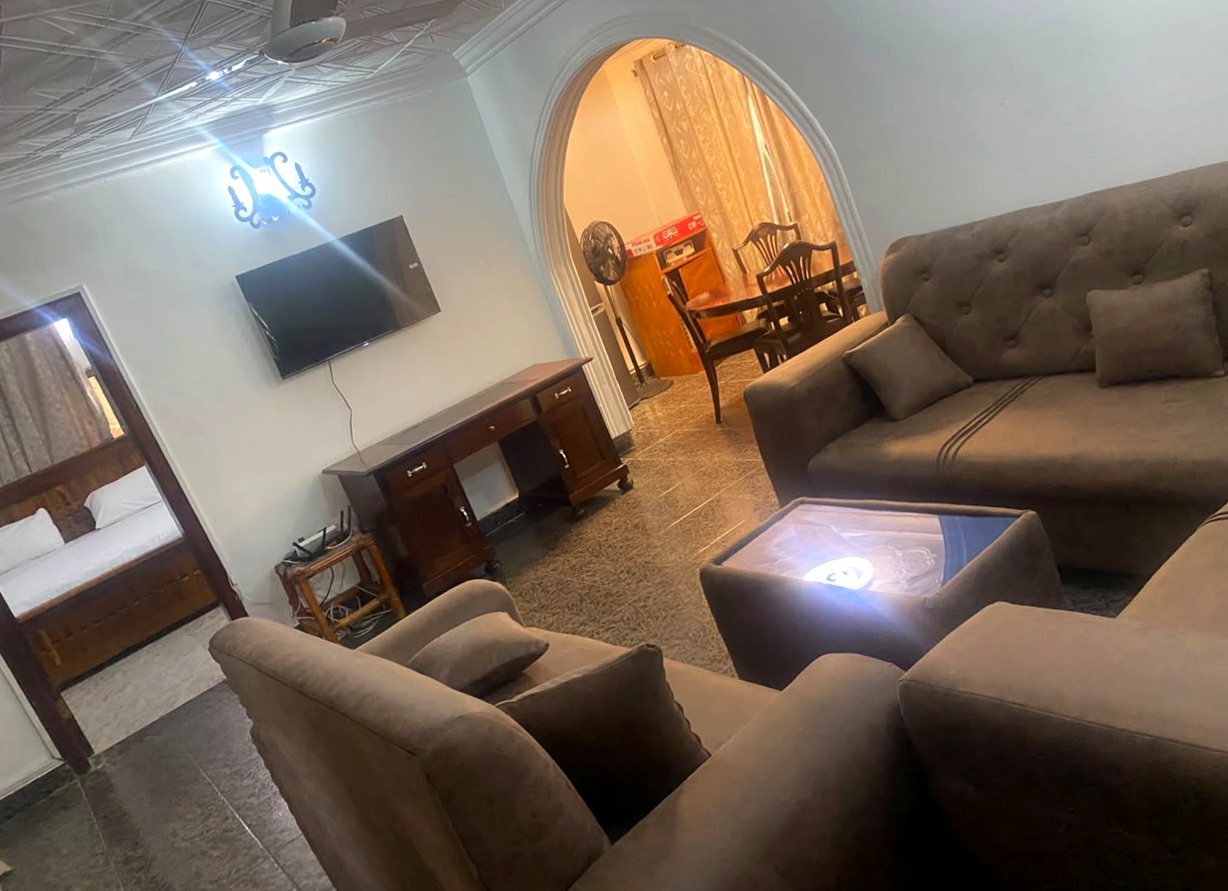 Living room in the Main House with an arch to the dining area